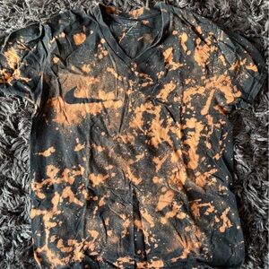 Nike gender neutral Tee in Black and Orange Splash